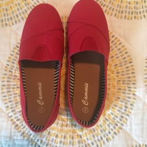 Red slip on “Tom” shoes